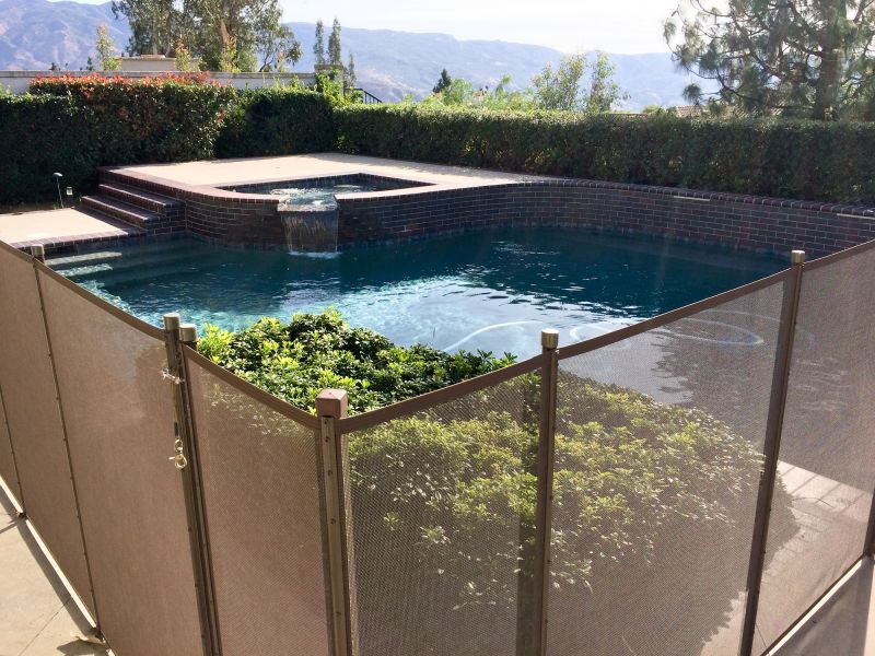 Removable Mesh Fence Securing Pool Area